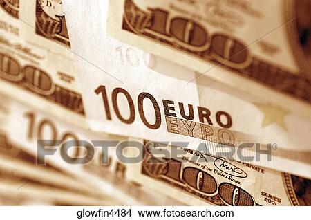 Euro 100 bank notes and United States one hundred dollar bills, close-up View Large Photo Image Picture - Euro 100 bank notes and United States one hundred dollar bills, close-up. Fotosearch
