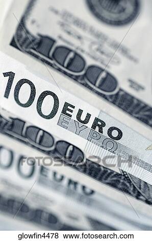 Euro 100 bank notes and United States one hundred dollar bills, close-up View Large Photo Image Stock Photo - Euro 100 bank notes and United States one hundred dollar bills, close-up. Fotosearch