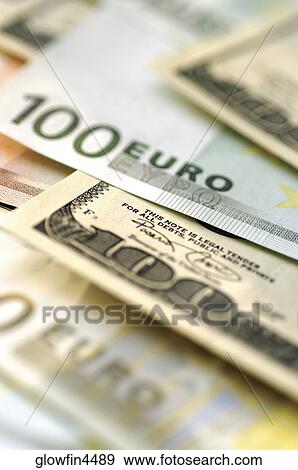 Euro 100 bank notes and United States one hundred dollar bills, close-up View Large Photo Image Stock Photo - Euro 100 bank notes and United States one hundred dollar bills, close-up. Fotosearch