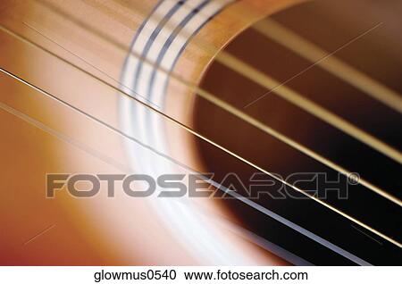 Extreme close-up of guitar and its strings View Large Photo Image Stock Image - Extreme close-up of guitar and its strings. Fotosearch