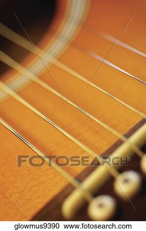 Extreme close-up of guitar bridge and strings View Large Photo Image Stock Image - Extreme close-up of guitar bridge and strings. Fotosearch