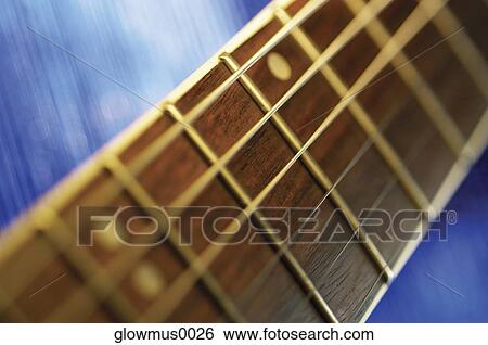 Stock Photograph - Extreme close-up of guitar bridge. Fotosearch