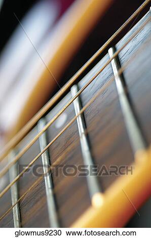 Extreme close-up of guitar frets and strings View Large Photo Image Stock Image - Extreme close-up of guitar frets and strings. Fotosearch