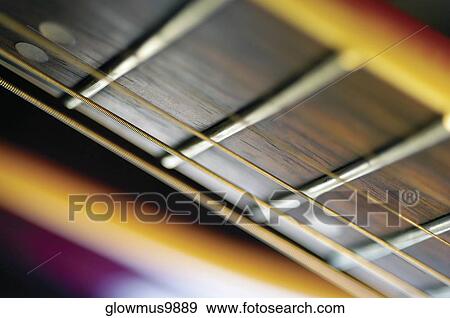 Extreme close-up of guitar frets and strings View Large Photo Image Stock Photo - Extreme close-up of guitar frets and strings. Fotosearch