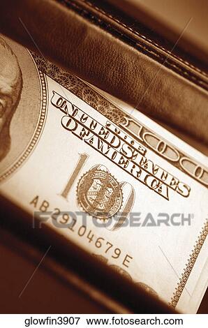 Extreme close-up of one hundred dollar bill inside wallet View Large Photo Image Stock Photo - Extreme close-up of one hundred dollar bill inside wallet. Fotosearch
