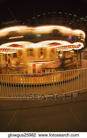 Stock Image - Facade of a carousel at night. Fotosearch