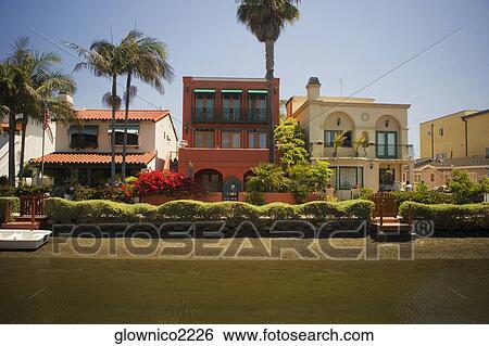 Stock Photograph - Facade of houses along a canal, Venice, Los Angeles, California, USA. Fotosearch