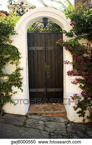Facade of wooden doors in a stucco arch, Los Angeles, California, USA View Large Photo Image Stock Image - Facade of wooden doors in a stucco arch, Los Angeles, California, USA. Fotosearch