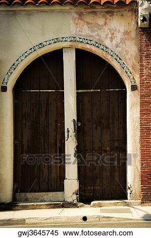 Facade of wooden doors on a stucco building, Los Angeles, California, USA View Large Photo Image Stock Photography - Facade of wooden doors on a stucco building, Los Angeles, California, USA. Fotosearch