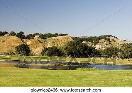 High angle view of a lake on a golf course View Large Photo Image Stock Photograph - High angle view of a lake on a golf course. Fotosearch