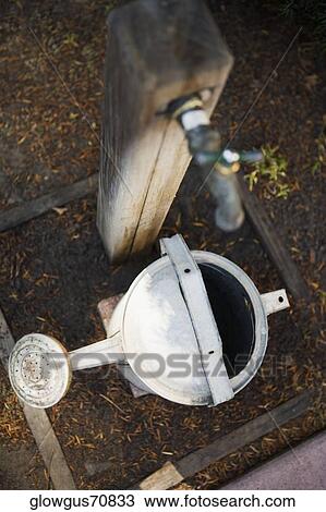 High angle view of a watering can View Large Photo Image Stock Image - High angle view of a watering can. Fotosearch