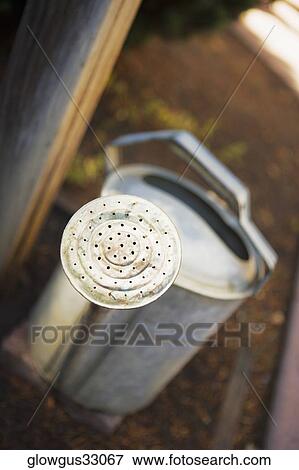 High angle view of a watering can View Large Photo Image Stock Photo - High angle view of a watering can. Fotosearch