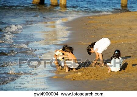Picture - High angle view of children playing on the beach, San Diego, California, USA. Fotosearch