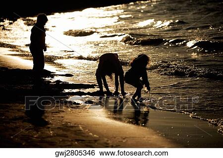 Stock Photograph - High angle view of children playing on the beach, San Diego, California, USA. Fotosearch