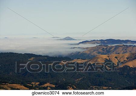 High angle view of clouds over mountains View Large Photo Image Picture - High angle view of clouds over mountains. Fotosearch