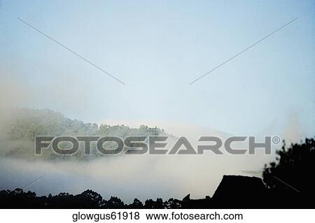 High angle view of fog on a hill range View Large Photo Image Stock Photo - High angle view of fog on a hill range. Fotosearch