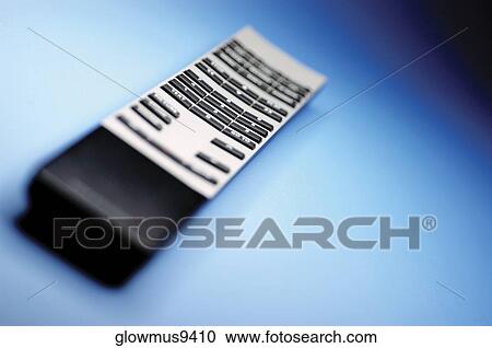 Stock Image - High angle view of remote control. Fotosearch
