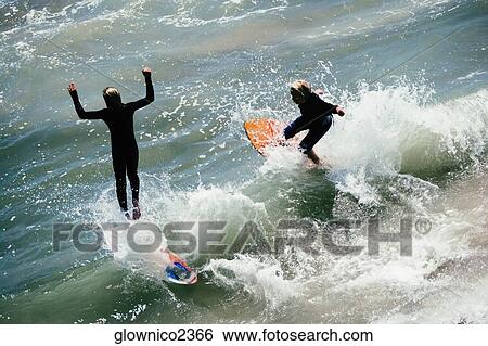 High angle view of two boogie boarder's on the beach View Large Photo Image Stock Photograph - High angle view of two boogie boarder's on the beach. Fotosearch