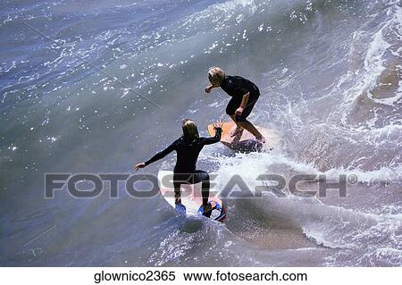 High angle view of two boogie boarder's on the beach View Large Photo Image Stock Photography - High angle view of two boogie boarder's on the beach. Fotosearch