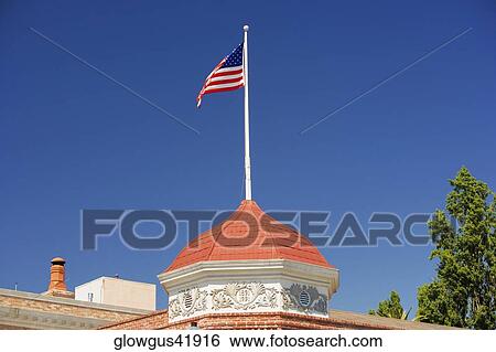 High section view of a building with an American flag on the top of it View Large Photo Image Stock Photograph - High section view of a building with an American flag on the top of it. Fotosearch