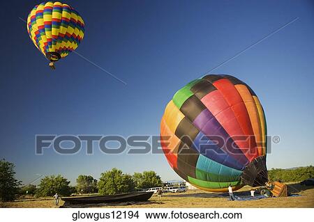 Hot air balloon preparing to take off View Large Photo Image Picture - Hot air balloon preparing to take off. Fotosearch