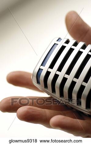 Human hand holding microphone View Large Photo Image Stock Photo - Human hand holding microphone. Fotosearch