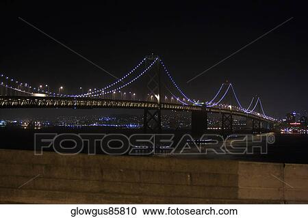 Stock Image - Illuminated bridge at night, Golden Gate Bridge, San Francisco, California, USA. Fotosearch