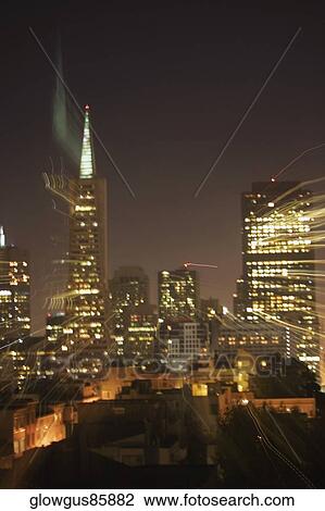 Stock Image - Illuminated buildings at night, California, USA. Fotosearch
