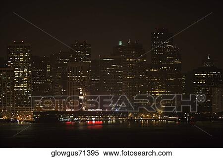 Stock Photography - Illuminated buildings at waterfront, California, USA. Fotosearch
