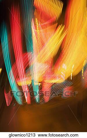 Lights glowing on a carnival ride at night, California, USA View Large Photo Image Stock Image - Lights glowing on a carnival ride at night, California, USA. Fotosearch
