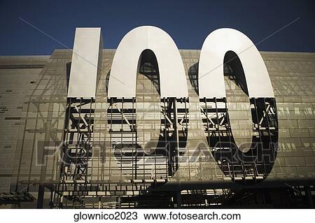 Low angle view of a '100' sign under construction View Large Photo Image Stock Image - Low angle view of a '100' sign under construction. Fotosearch