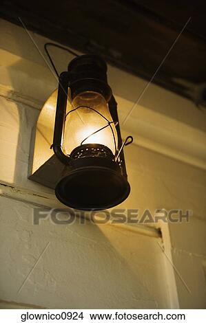 Picture - Low angle view of a lantern on a porch. Fotosearch