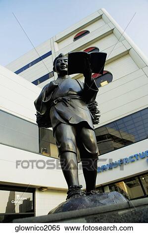 Stock Photography - Low angle view of a statue of a person reading, Los Angeles, California, USA. Fotosearch