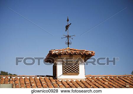 Low angle view of a weather vane on a rooftop View Large Photo Image Stock Photo - Low angle view of a weather vane on a rooftop. Fotosearch