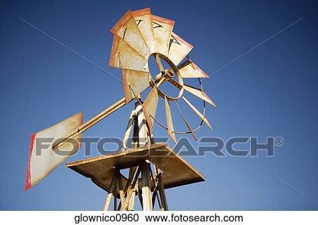Stock Image - Low angle view of a windmill. Fotosearch