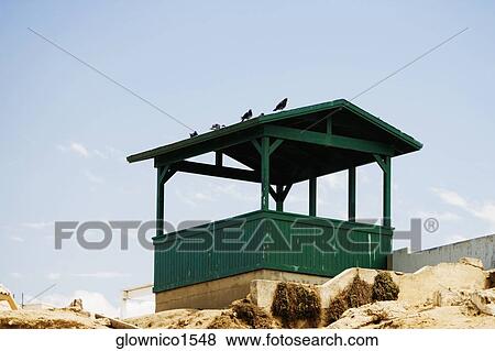 Low angle view of a wooden gazebo on the beach View Large Photo Image Stock Photo - Low angle view of a wooden gazebo on the beach. Fotosearch