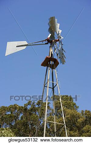 Low angle view of an industrial windmill View Large Photo Image Stock Image - Low angle view of an industrial windmill. Fotosearch