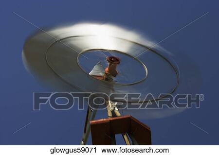Low angle view of an industrial windmill View Large Photo Image Stock Image - Low angle view of an industrial windmill. Fotosearch