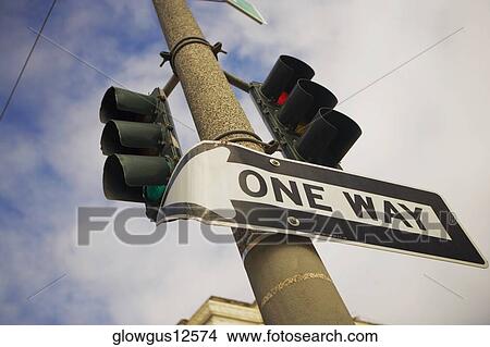 Low angle view of one way sign View Large Photo Image Picture - Low angle view of one way sign. Fotosearch