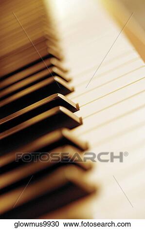 Low angle view of piano keyboard View Large Photo Image Stock Image - Low angle view of piano keyboard. Fotosearch