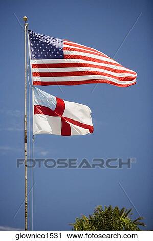 Stock Image - Low angle view of the American Flag. Fotosearch