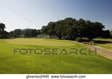 Panoramic view of a golf course View Large Photo Image Stock Image - Panoramic view of a golf course. Fotosearch