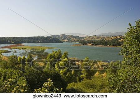 Panoramic view of a lake View Large Photo Image Stock Photo - Panoramic view of a lake. Fotosearch