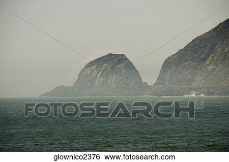 Panoramic view of rock formations in the sea View Large Photo Image Stock Photograph - Panoramic view of rock formations in the sea. Fotosearch