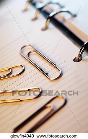 Paper clips on top of appointment book, close-up View Large Photo Image Stock Image - Paper clips on top of appointment book, close-up. Fotosearch