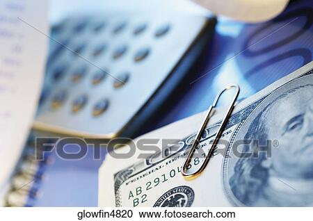 Paper clips, United States one hundred dollar bills, calculator View Large Photo Image Stock Image - Paper clips, United States one hundred dollar bills, calculator. Fotosearch