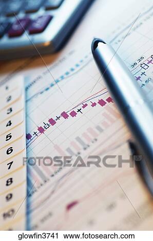 Pen, calculator and financial graphs, close-up View Large Photo Image Stock Image - Pen, calculator and financial graphs, close-up. Fotosearch