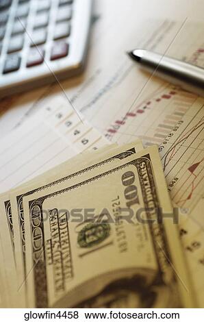 Pen, calculator and financial graphs, close-up View Large Photo Image Stock Photo - Pen, calculator and financial graphs, close-up. Fotosearch