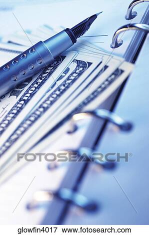 Pen, spiral notebook and United States one hundred dollar bills View Large Photo Image Stock Photo - Pen, spiral notebook and United States one hundred dollar bills. Fotosearch