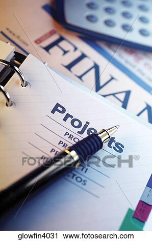 Pen, spiral notebook, planning list, financial section of newspaper and calculator, close-up View Large Photo Image Stock Image - Pen, spiral notebook, planning list, financial section of newspaper and calculator, close-up. Fotosearch